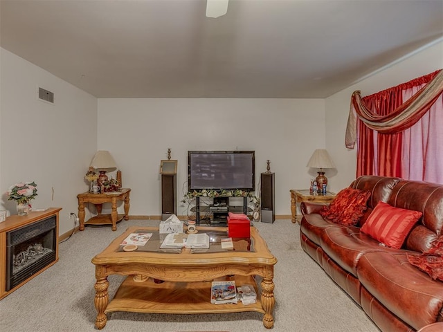 209 S 2nd Ave, Stroud, OK 74079 - carpeted living area featuring visible vents and baseboards
