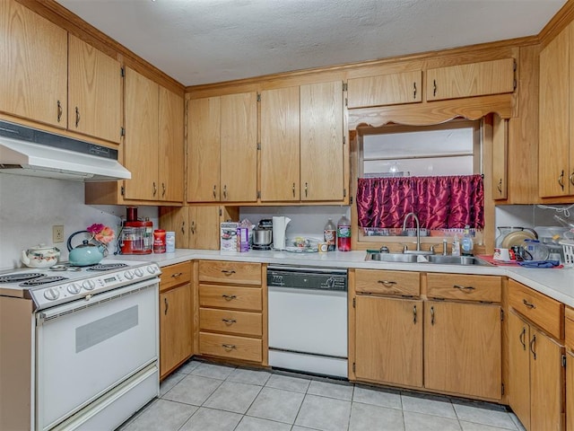 209 S 2nd Ave, Stroud, OK 74079 - kitchen featuring white appliances, under cabinet range hood, light tile patterned flooring, light countertops, and a sink
