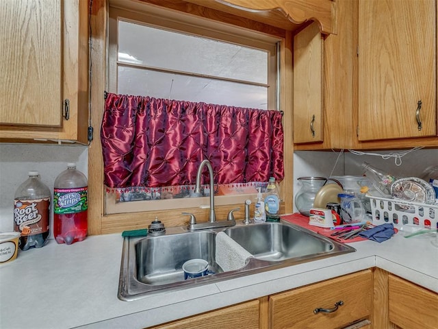 209 S 2nd Ave, Stroud, OK 74079 - kitchen featuring light countertops and a sink