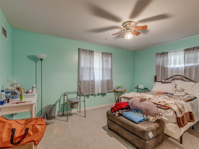 209 S 2nd Ave, Stroud, OK 74079 - bedroom with visible vents, ceiling fan, baseboards, and carpet