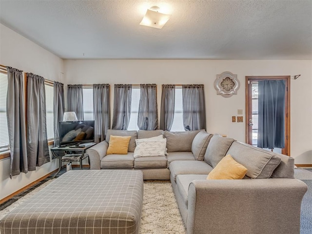 209 S 2nd Ave, Stroud, OK 74079 - living area featuring a textured ceiling