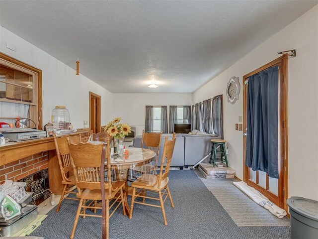 209 S 2nd Ave, Stroud, OK 74079 - dining space with carpet