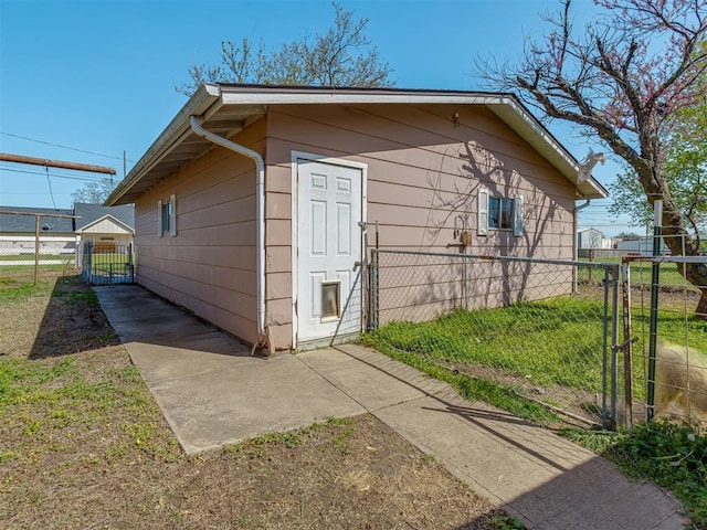 209 S 2nd Ave, Stroud, OK 74079 - view of outbuilding with fence and a gate