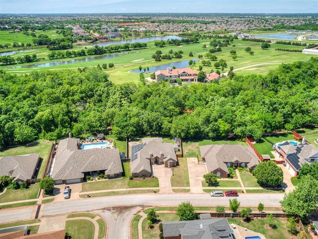 birds eye view of property featuring a water view, a residential view, and golf course view