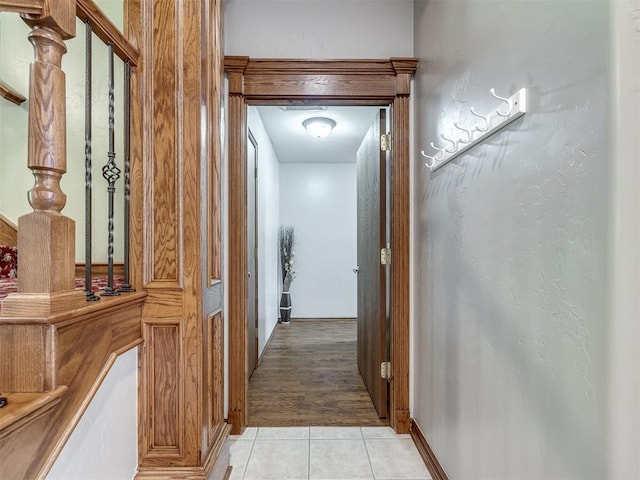 hallway featuring light tile patterned flooring