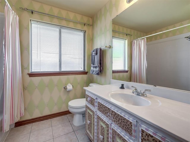 bathroom with tile patterned flooring, vanity, toilet, wallpapered walls, and baseboards