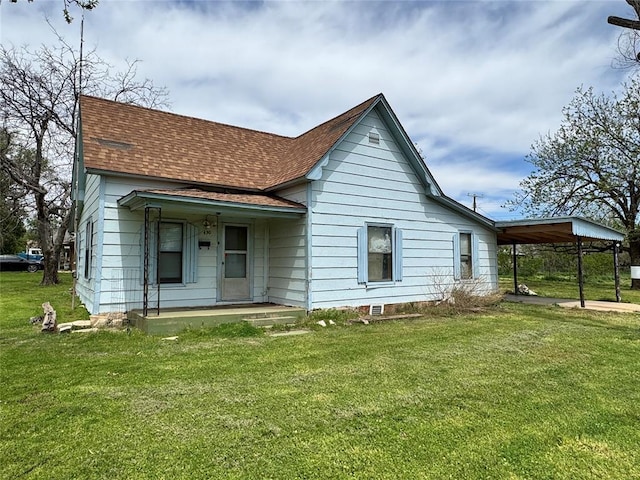 430 S Park Rd, Hobart, OK 73651 - back of house with a carport, roof with shingles, a lawn, and covered porch