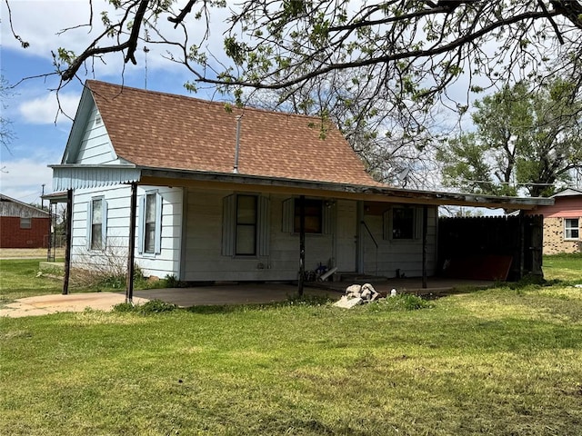 430 S Park Rd, Hobart, OK 73651 - back of property with roof with shingles, a patio area, and a lawn