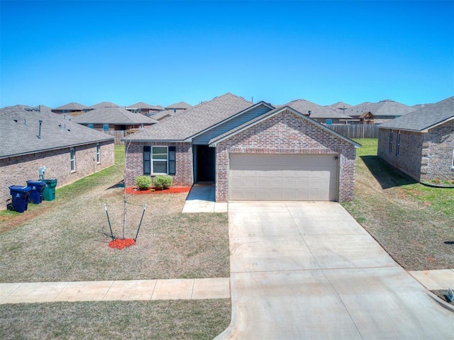 9704 Saddle Dr, Yukon, OK 73099 - single story home with concrete driveway, a front lawn, brick siding, a garage, and a residential view