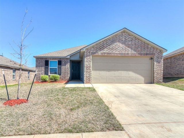9704 Saddle Dr, Yukon, OK 73099 - ranch-style house featuring concrete driveway, a front yard, brick siding, a garage, and a shingled roof