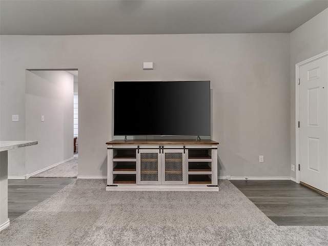 9704 Saddle Dr, Yukon, OK 73099 - unfurnished living room with wood finished floors and baseboards