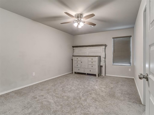 9704 Saddle Dr, Yukon, OK 73099 - unfurnished bedroom with carpet floors, baseboards, and a ceiling fan