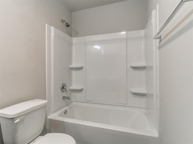 9704 Saddle Dr, Yukon, OK 73099 - bathroom featuring shower / bathing tub combination and toilet