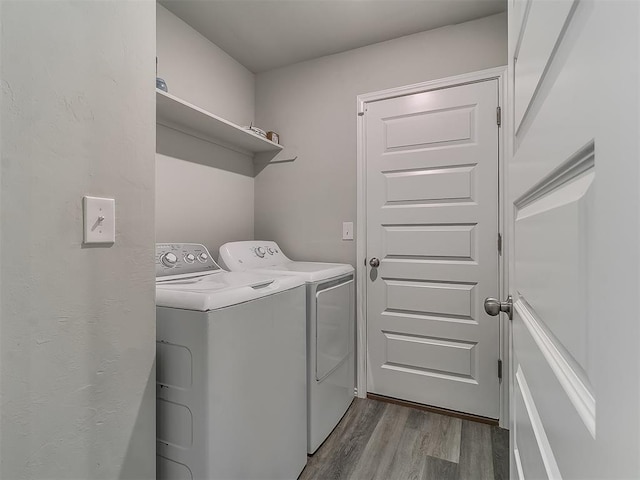 9704 Saddle Dr, Yukon, OK 73099 - washroom featuring light wood-style floors, washing machine and dryer, and laundry area