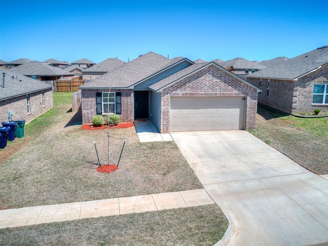 9704 Saddle Dr, Yukon, OK 73099 - single story home with brick siding, a front yard, driveway, and a garage