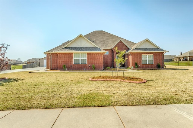 5800 SE 142nd St, Oklahoma City, OK 73165 - ranch-style home with brick siding, a front yard, fence, and driveway