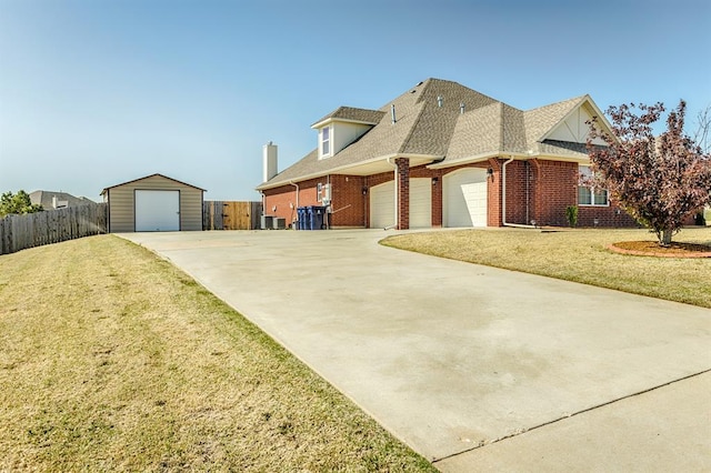 5800 SE 142nd St, Oklahoma City, OK 73165 - view of front of home featuring a front yard, brick siding, fence, and a shingled roof