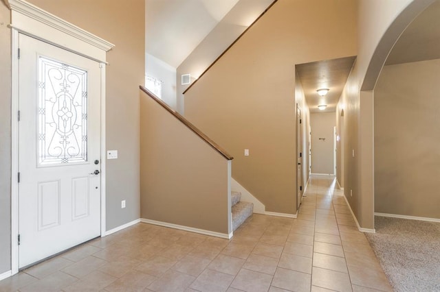 5800 SE 142nd St, Oklahoma City, OK 73165 - entryway featuring arched walkways, visible vents, stairway, light tile patterned flooring, and baseboards