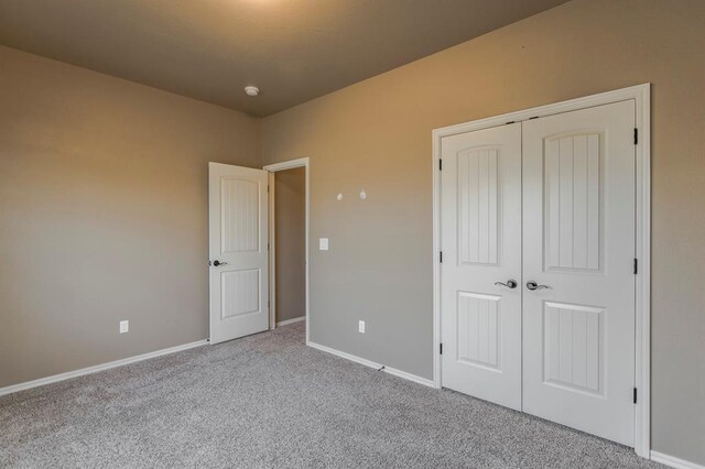 5800 SE 142nd St, Oklahoma City, OK 73165 - unfurnished bedroom with carpet floors, baseboards, and a closet