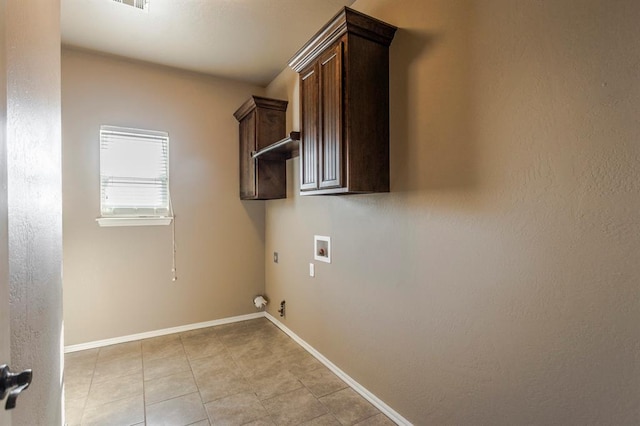 5800 SE 142nd St, Oklahoma City, OK 73165 - clothes washing area featuring baseboards, gas dryer hookup, light tile patterned floors, hookup for a washing machine, and cabinet space