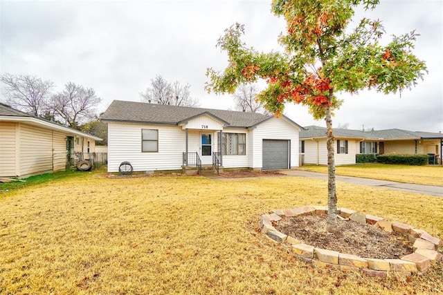 718 E Johnson St, Norman, OK 73071 - single story home featuring a front lawn, a garage, and driveway
