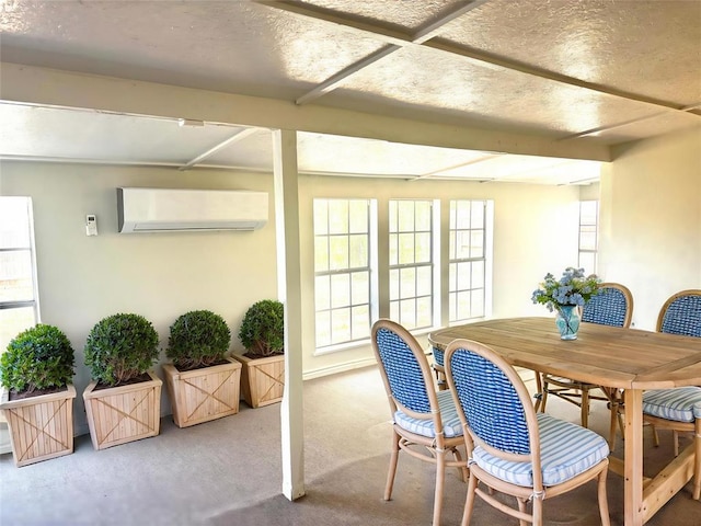 dining space with a wall unit AC and carpet floors