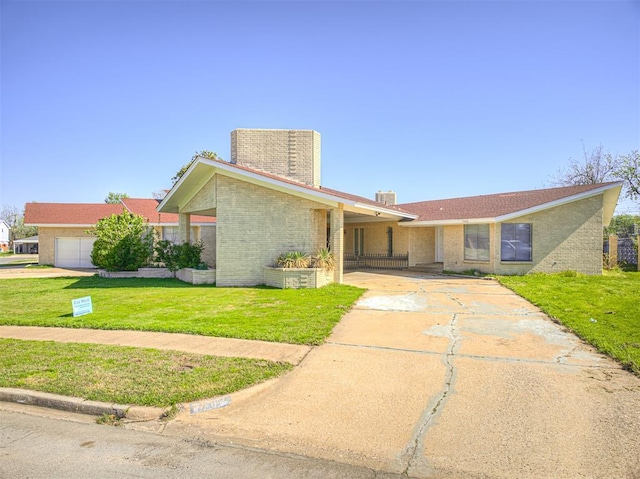 7700 S Country Club Dr, Oklahoma City, OK 73159 - view of front of home with brick siding, driveway, a chimney, and a front lawn