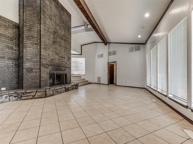 7700 S Country Club Dr, Oklahoma City, OK 73159 - unfurnished living room featuring visible vents, beam ceiling, light tile patterned floors, and high vaulted ceiling