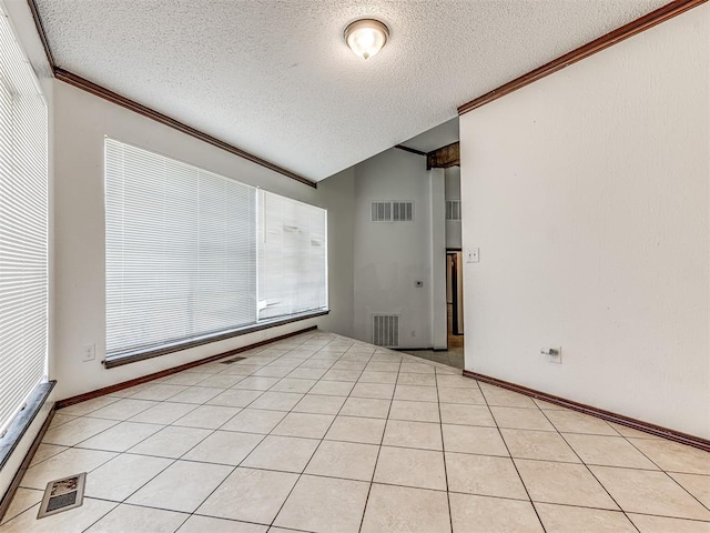 7700 S Country Club Dr, Oklahoma City, OK 73159 - spare room featuring ornamental molding, a textured ceiling, and visible vents