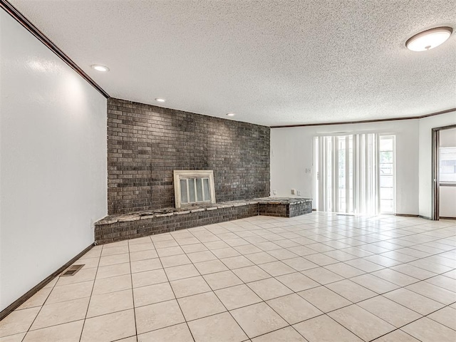 7700 S Country Club Dr, Oklahoma City, OK 73159 - unfurnished living room with a textured ceiling, recessed lighting, and ornamental molding