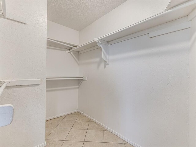 7700 S Country Club Dr, Oklahoma City, OK 73159 - spacious closet featuring light tile patterned floors