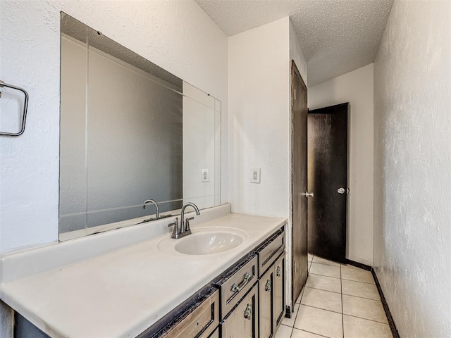 7700 S Country Club Dr, Oklahoma City, OK 73159 - bathroom with a textured wall, vanity, and tile patterned flooring