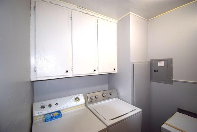 605 SW 6th St, Lindsay, OK 73052 - laundry room featuring electric panel, separate washer and dryer, and cabinet space