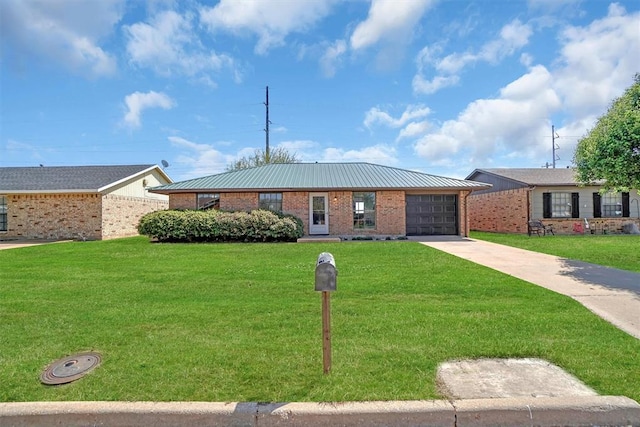 ranch-style house featuring concrete driveway, a front lawn, an attached garage, brick siding, and metal roof