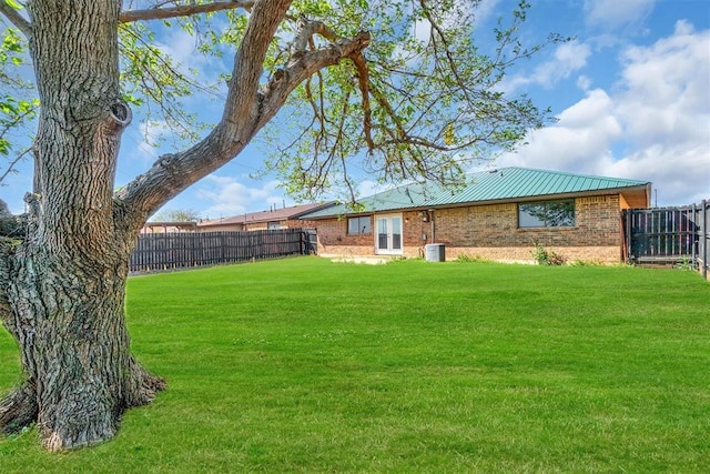 view of yard with a fenced backyard
