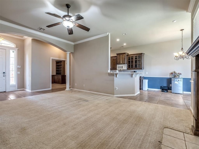 unfurnished living room featuring light colored carpet, ornamental molding, light tile patterned floors, and visible vents