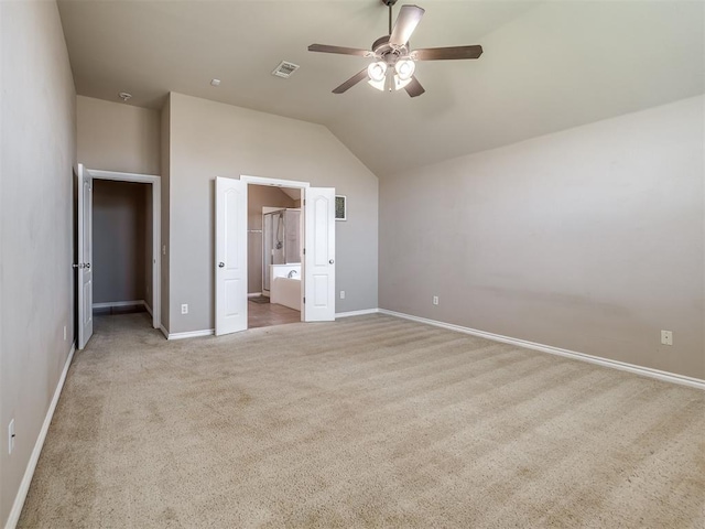 unfurnished bedroom with a ceiling fan, visible vents, vaulted ceiling, carpet floors, and baseboards