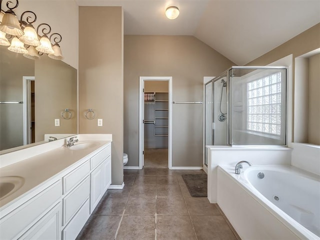 bathroom featuring a jetted tub, a shower stall, a sink, a notable chandelier, and vaulted ceiling
