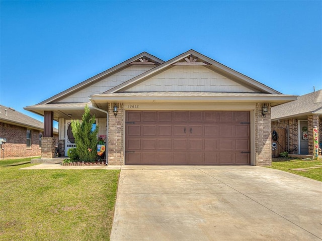 ranch-style home featuring a front lawn, driveway, and brick siding