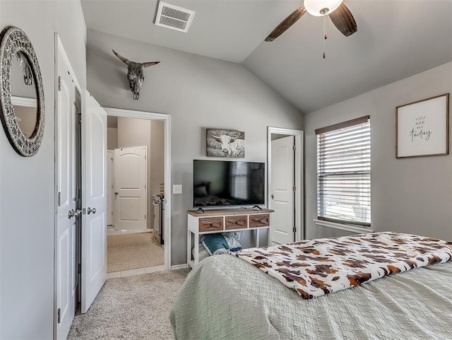 bedroom featuring visible vents, a ceiling fan, light colored carpet, and vaulted ceiling