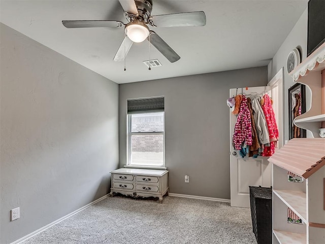 carpeted bedroom with visible vents, ceiling fan, and baseboards