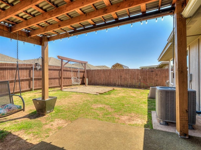 view of yard with central AC, a patio, and a fenced backyard