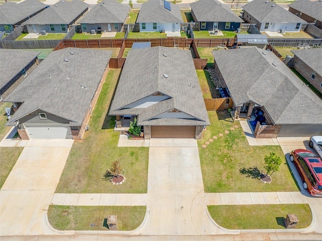 birds eye view of property with a residential view