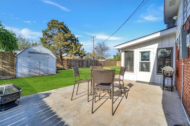 view of patio with a grill, a shed, a fenced backyard, an outdoor structure, and outdoor dining area