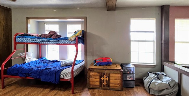 17904 Kings Rd, Shawnee, OK 74801 - bedroom featuring wood finished floors, multiple windows, and beamed ceiling