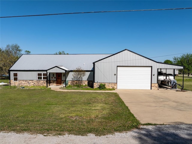4556 Cobra Ln, Kingston, OK 73439 - modern inspired farmhouse with a front lawn, stone siding, and a detached garage
