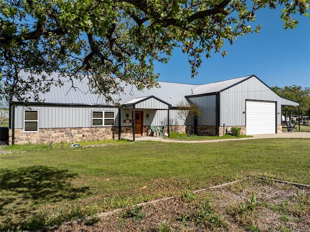 4556 Cobra Ln, Kingston, OK 73439 - modern farmhouse featuring a garage, stone siding, a front lawn, and metal roof