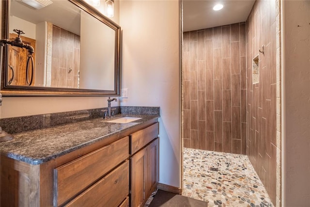 4556 Cobra Ln, Kingston, OK 73439 - bathroom with tiled shower, vanity, and recessed lighting