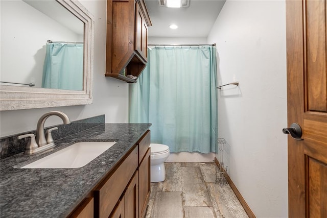 4556 Cobra Ln, Kingston, OK 73439 - bathroom with shower / bath combination with curtain, stone tile floors, vanity, toilet, and baseboards