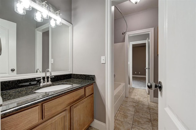 bathroom with a bathtub and vanity